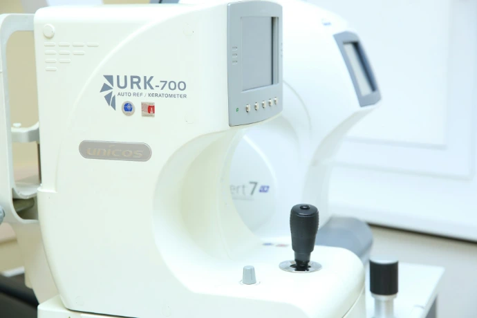 a white machine with a black handle on it